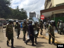 FILE - Kenyan riot police cordon off the electoral commission headquarters in Nairobi, May 24, 2016. (J. Craig/VOA)