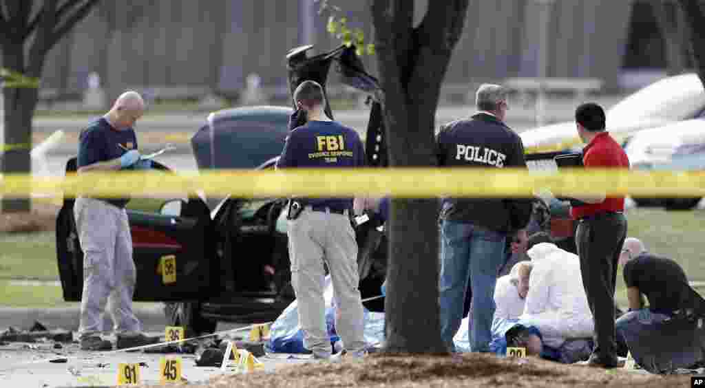 Police shot and killed two men after they opened fire on a security officer outside a suburban Dallas venue that was hosting a provocative exhibit of Prophet Muhammad cartoons Sunday night, authorities said.