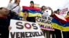 FILE - Demonstrators who are against the Venezuelan government chant outside of the Organization of American States during the special meeting of the Permanent Council, in Washington, April 3, 2017, to consider the recent events in Venezuela.