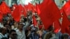 People shout slogans during a protest by the Portuguese Communist party, demanding the breakup of the Portuguese parliament and early elections, in Lisbon, July 3, 2013.