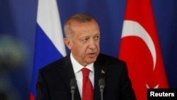 FILE - Turkish President Recep Tayyip Erdogan attends a news conference in Moscow, Russia, Aug. 27, 2019.