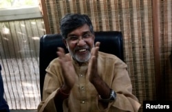 Indian children's right activist Kailash Satyarthi speaks with the media at his office in New Delhi, Oct. 10, 2014.
