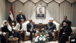 United Nations special envoy to Syria Kofi Annan (3rd Left) meets with Ahmad Badr Al Din Hassoun, Syria's Grand Muft (2nd Right), in Damascus, Syria, March 11, 201