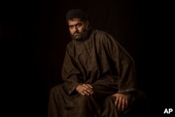 Firdous Ahmas Dar poses for a portrait in the village of Sopore, Indian-controlled Kashmir, Dec. 1, 2016. Firdous, 25, lost vision in both eyes after Indian troops used shotguns to spray hundreds of metal pellets to quell an anti-India protest in the troubled Himalayan region.