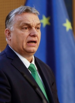 FILE - Hungary's Prime Minister Viktor Orban speaks at a news conference in Prague, Czech Republic, March 4, 2020.