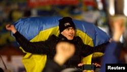 Pro-European integration protesters attend a rally at Independence Square in Kyiv, December 8, 2013.