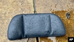This photo provided by Diane Flaherty shows a headrest from Alaska Airlines flight 1282 on the ground in Flaherty's backyard in southwest Portland, Ore., Jan. 8, 2024.