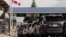 FILE - People at the U.S.-Canadian border in Blaine, Washington, U.S., Aug. 9, 2021.