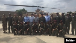 Members of a U.S. congressional delegation, headed by Republican Senator John McCain (6-L, 2nd row), pose for a picture with Dragon helicopter pilots from the Pakistani Air Force in Miramshah, North Waziristan, Pakistan, July 3, 2016. (@SenJohnMcCain)