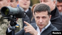 Ukrainian President Volodymyr Zelenskiy attends a joint drill of departments of Interior Ministry at the International training Centre near the village of Stare in Kyiv region, Ukraine, Sept. 30, 2019. 