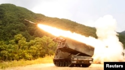 FILE - A rocket is launched from an MLRS during a training exercise involving part of the U.S. 2nd Infantry Division and the South Korean army at Cheorwon, South Korea, June 12, 2012. Ukraine has been pleading for weeks with the U.S. to get American-made MLRS weaponry.