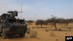 FILE - A light armored vehicle of the French counterterrorism Barkhane force in Africa's Sahel region is seen near the town of Gossi, central Mali, March 25, 2019.