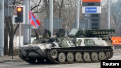 Pro-Russian rebels drive a Strela-10 self-propelled anti-aircraft system in Donetsk Feb. 3, 2015.
