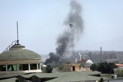 Smoke rises next to the U.S. Embassy in Kabul, Afghanistan, Aug. 15, 2021. Taliban fighters entered the outskirts of the Afghan capital, further tightening their grip on the country.
