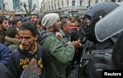 Tunisian protesters clash with riot police during demonstrations against rising prices and tax increases, in Tunis, Tunisia, Jan. 12, 2018.