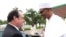 Nigerian President Muhammadu Buhari welcomes French President Francois Hollande in Abuja, site of a summit to discuss regional security and strategies to fight Boko Haram, May 14, 2016. 