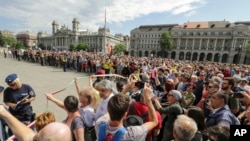 Anti-government protesters are seen gathered in front of the Parliament building on Kossuth square during the inaugural session of the new parliament, in Budapest, Hungary, May 8, 2018.
