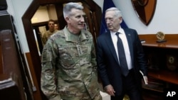 U.S. Defense Secretary James Mattis, right, and U.S. Army General John Nicholson, left, commander of U.S. Forces Afghanistan, arrive to meet with an Afghan defense delegation in Kabul Afghanistan, April 24, 2017. 
