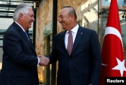 U.S. Secretary of State Rex Tillerson, left, meets with Turkish Foreign Minister Mevlut Cavusoglu in Istanbul, Turkey, July 9, 2017.