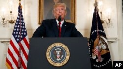 President Donald Trump pauses as he speaks about the deadly white nationalist rally in Charlottesville, Va., Aug. 14, 2017, in the Diplomatic Room of the White House in Washington. 