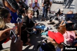 Albuquerque mayor Tim Keller leaves a stuff animal outside of the children's tent encampment built to deal with the Trump administrations "zero tolerance" policy in Tornillo, Texas, June 21, 2018.