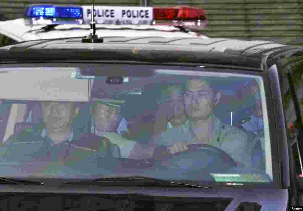 Bo Xilai leaves the Jinan Intermediate People's Court building in a vehicle in Jinan, Shandong province in this photo taken by Kyodo, August 23, 2013. 