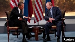 U.S. President Barack Obama (L) meets with Russian President Vladimir Putin during the G8 Summit at Lough Erne in Enniskillen, Northern Ireland, June 17, 2013.