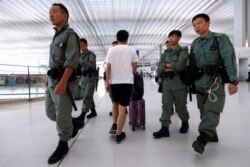 Riot police patrol inside Hong Kong International Airport in Hong Kong, Sept. 22, 2019.