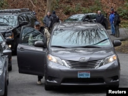 FILE - A vehicle with diplomatic license plates departs from a Russian compound in Upper Brookville, Long Island, New York, U.S., Dec. 30, 2016.
