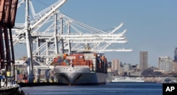 FILE - A container ship is moored at the Port of Seattle's seaport on the Duwamish Waterway. Trade is an important element of Obama's rebalance policy.