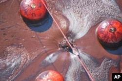 Coast Guard Cutter Cypress' skimmer hard at work in a large patch of oil in the Gulf of Mexico.
