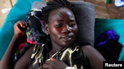 FILE - A South Sudanese woman suffering from cholera lies on a bed at Juba Teaching Hospital in Juba, May 27, 2014. 