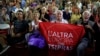 Supporters of left-wing Syriza party react as they watch the election results at the party’s main electoral center in Athens, Sunday, Sept. 20, 2015. 