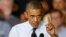 President Barack Obama gestures as he speaks to workers at the Ford Kansas City Stamping Plant in Liberty, Missouri, Sept. 20, 2013.