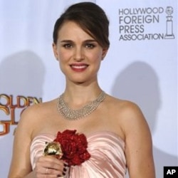Natalie Portman holds her award for Best Performance by an Actress in a Motion Picture - Drama for her role in "Black Swan," at the Golden Globe Awards 16 Jan. 2011, in Beverly Hills, California.