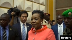 Newly parliamentary-elected interim President of the Central African Republic Catherine Samba-Panza walks into the National Assembly prior to her swearing-in ceremony in the capital Bangui, Jan. 23, 2014.