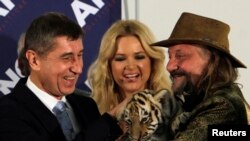 Nobel Peace Prize laureates Malala Yousafzai and Kailash Satyarthi pose with their medals during the Nobel Peace Prize awards ceremony at the City Hall in Oslo, Norway, Dec. 10, 2014.