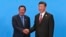 Cambodian Prime Minister Hun Sen, left, and Chinese President Xi Jinping, right, shake hands during the welcome ceremony for the Belt and Road Forum, at the International Conference Center at Yanqi Lake in Beijing, Monday, May 15, 2017. (Roman Pilipey/Pool Photo via AP)
