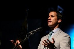 Venezuelan opposition leader Juan Guaido attends a meeting with representatives of Venezuela's private industrial sector in Caracas, June 26, 2019.