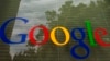 FILE - The Google logo on a window at the company's headquarters in Mountain View, California. 