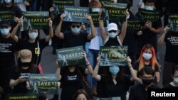 Protesters holding placards attend a rally calling China to release 12 Hong Kong people arrested at sea by mainland authorities, in Taipei, Taiwan, October 25, 2020.