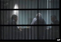 From right, German Interior Minister and delegate of the German Christian Democratic Party (CDU) Thomas de Maiziere, the governor of the German state of Hesse, Volker Bouffier, and Ralf Stegner, deputy chairman of the Social Democratic Party (SPD) talk in Berlin, Jan. 11, 2018, during final exploratory talks on a new German government between the Christian Unions block and the Social Democratic Party.