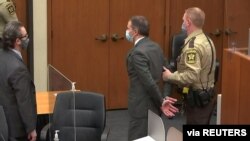 Former Minneapolis police officer Derek Chauvin is led away in handcuffs after a jury found him guilty of all charges in his trial for murder in the death of George Floyd in Minneapolis, Minnesota, April 20, 2021.