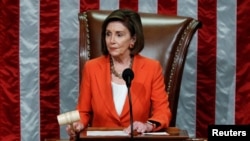 Speaker of the House Nancy Pelosi wields the gavel as she presides over the U.S. House of Representatives vote on a resolution that sets up the next steps in the impeachment inquiry of President Donald Trump on Capitol Hill in Washington, Oct. 31, 2019.