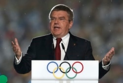 FILE - International Olympic Committee (IOC) President Thomas Bach delivers a speech during the closing ceremony of the 2014 Nanjing Youth Olympic Games in Nanjing, Jiangsu province, August 2014.