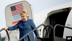 Democratic presidential candidate Hillary Clinton arrives at Eastern Iowa Airport in Cedar Rapids, Iowa, Oct. 28, 2016, to attend a rally. 