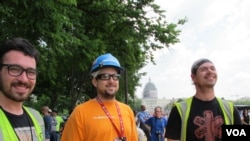 The flyover drew spectators including, from left, John Jumalon, Daniel McConnell and Ross Merchant. They were taking a break from construction work on the National Gallery of Art. Behind them is the Capitol dome under scaffolding for repairs.
