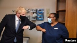 Britain's Prime Minister Boris Johnson visits the Tollgate Medical Centre in Beckton, London, Britain July 24, 2020.