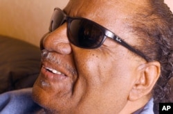 FILE - Clarence Fountain smiles during an interview before the start of the band's show at the Fillmore in San Francisco, Jan. 11, 2002.