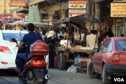 East Mosul was captured by Iraqi and coalition forces in January, and signs of recovery are evident in crowded shopping centers with increasing amounts of government electricity and water, July 9, 2017 in Mosul, Iraq. (H.Murdock/VOA)